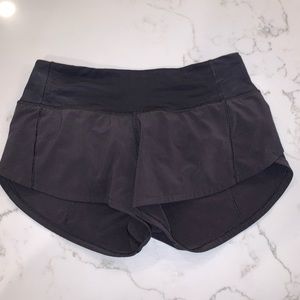 2 pairs of size 2 lululemon black speed-up shorts